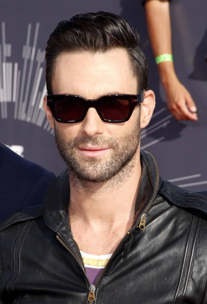 Adam Levine's sexy sunglasses were a nice pair for his vintage look of black leather jacket and slick pompadour hairstyle at the 2014 MTV Video Music Awards on August 24, 2014 in Los Angeles, California.