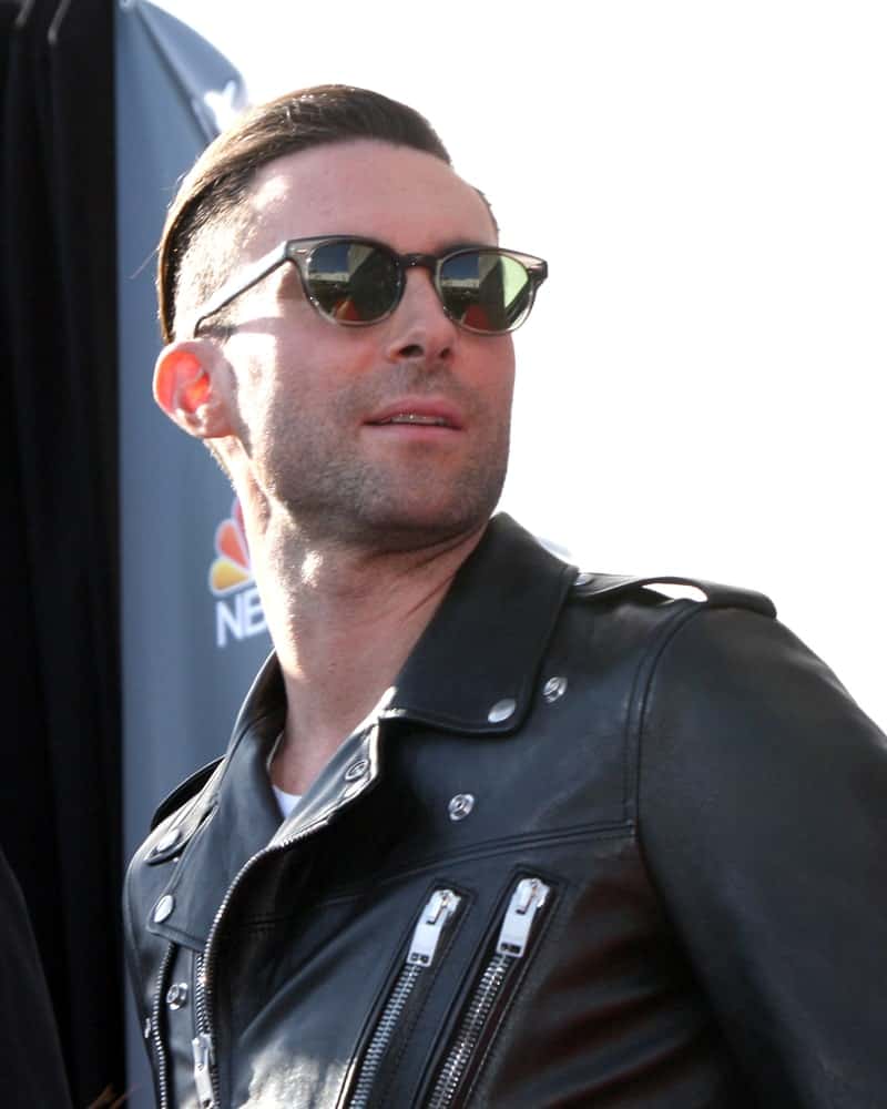 Adam Levine was edgy with his black leather jacket and brushed back undercut hairstyle at the “The Voice” Judges Photocall – April 2014 at The Sayers Club on April 3, 2014 in Los Angeles, CA.