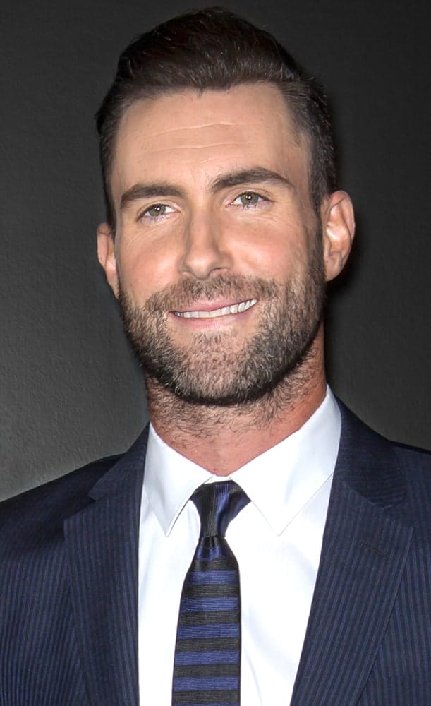 Adam Levine attended the closing night gala premiere of 'Begin Again' during the 2014 Tribeca Film Festival at BMCC Tribeca PAC. He was dapper in his blue suit and brushed up slick pompadour hairstyle and trimmed beard.