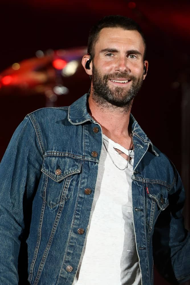 Adam Levine rocked the stage with a short buzz cut hairstyle and full beard during the CBS Radio's third annual We Can Survive at the Hollywood Bowl on October 24, 2015 in Hollywood, California.