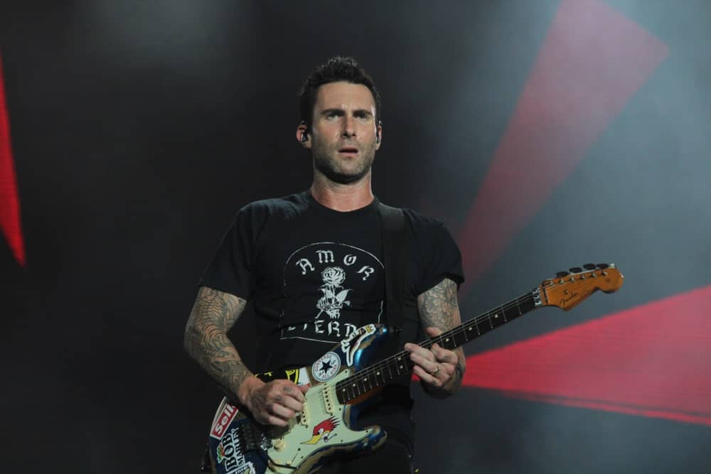 Adam Levine performed on stage at the Rock In Rio Festival on September 15, 2017. He looked sexy and carefree in his black printed shirt, five o'clock shadow and brushed up fade hairstyle.