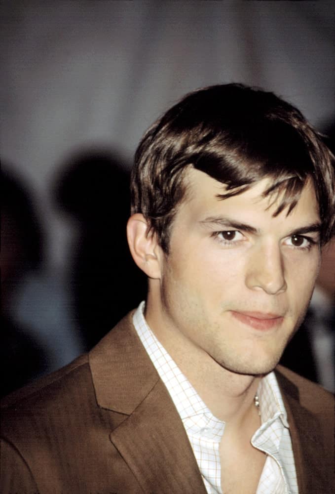 Ashton Kutcher wore a dapper tan suit with his short and tousled hairstyle with a slight side-parted finish at the Metropolitan Museum of Art Goddess Gala in New York on April 28, 2003.