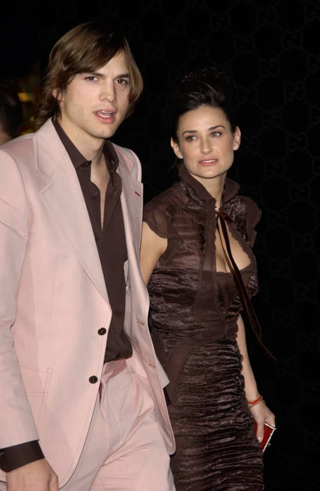 Ashton Kutcher's long and flowing dark brown hairstyle was side parted and paired well with his pink suit at the Rodeo Drive Walk of Style Gala honoring Gucci's Tom Ford on March 28, 2004.
