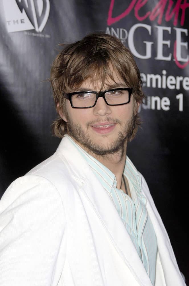 Ashton Kutcher looked amazing with his spectacles that complemented his tousled fringe hairstyle and trimmed beard at The WB Premiere of Beauty & The Geek in Geisha House, Los Angeles on May 25, 2005.