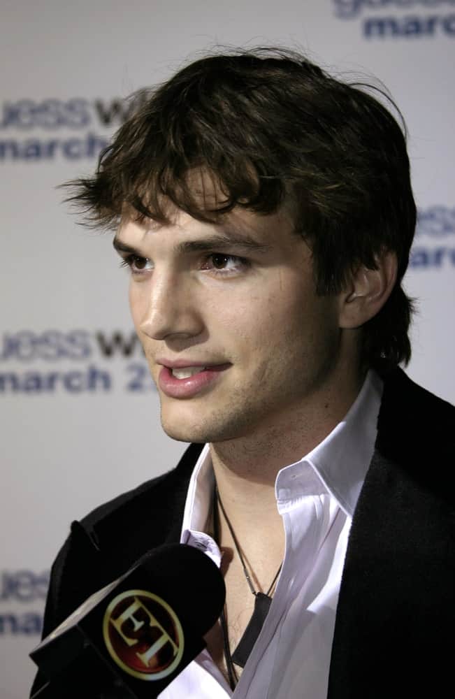 On March 13, 2005, actor Ashton Kutcher attended the "Guess Who" Premiere at the Graumann's Chinese Theatre. His five o'clock shadow went quite well with his casual curly fringe hairstyle.