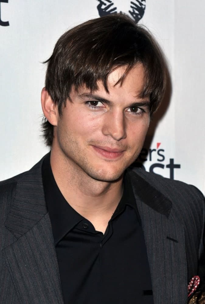 Ashton Kutcher had a short center-parted hairstyle that complemented his beautiful eyes and black suit at the Half the Sky Turning Oppression into Opportunity for Women Worldwide Book Party in New York on September 23, 2009.