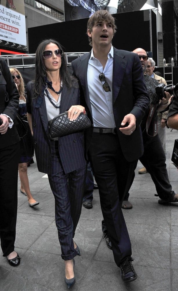 Demi Moore and Ashton Kutcher attended the Entertainment Industry Foundation Kick Off in Times Square, New York on September 10, 2009. Kutcher's elegant suit was balanced by his tousled and highlighted fringe hairstyle.