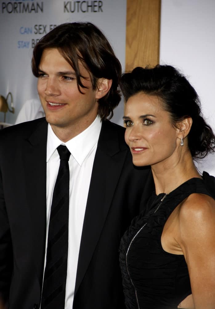 Ashton Kutcher and Demi Moore were at the Los Angeles premiere of 'No Strings Attached' held at the Regency Village Theater on January 11, 2011. Kutcher was handsome in his dapper black suit and long highlighted hairstyle.