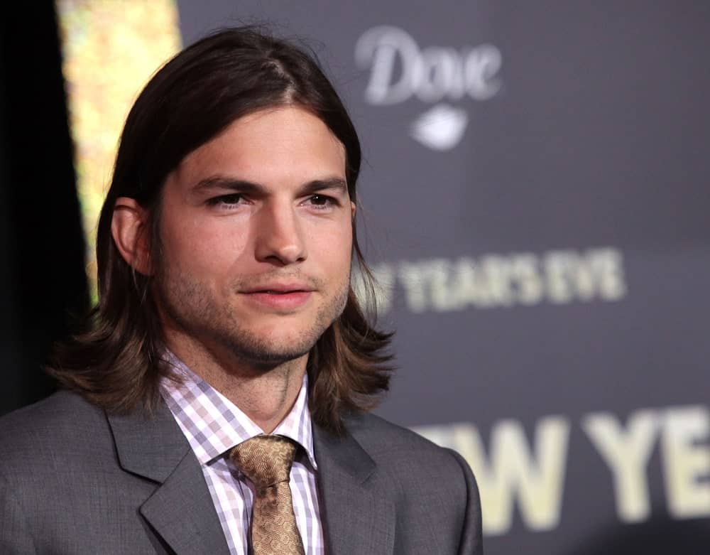 Ashton Kutcher was classy and edgy in his suit and long center-parted hairstyle at the "New Year's Eve" World Premiere on December 5, 2011 in Hollywood, CA.