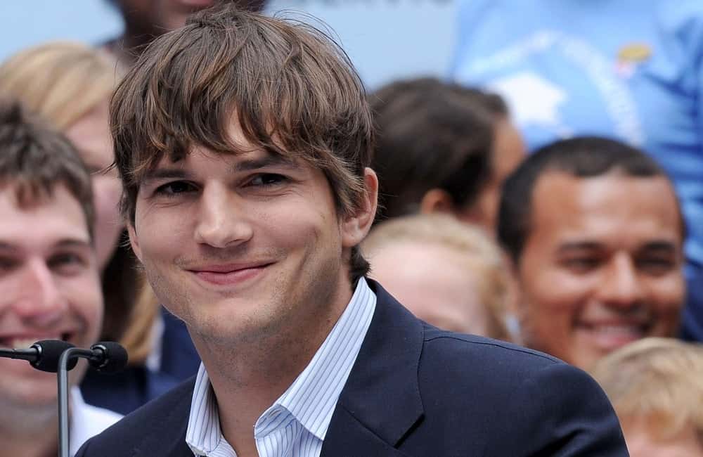 Ashton Kutcher smiles at the press conference for Entertainment Industry Foundation I PARTICIPATE Kick Off Promotes Volunteerism, Times Square, New York September 10, 2009.