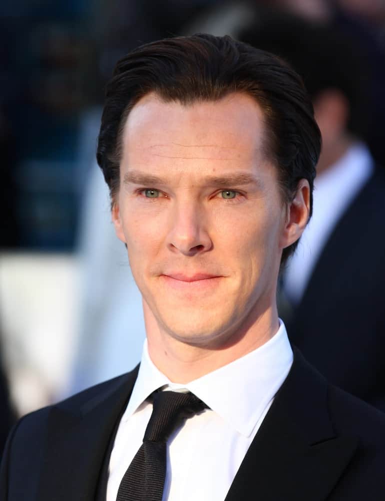 The English actor styled his medium-length black hair in a loose slicked back at the UK Premiere of Star Trek Into Darkness at The Empire Cinema on May 2, 2013.