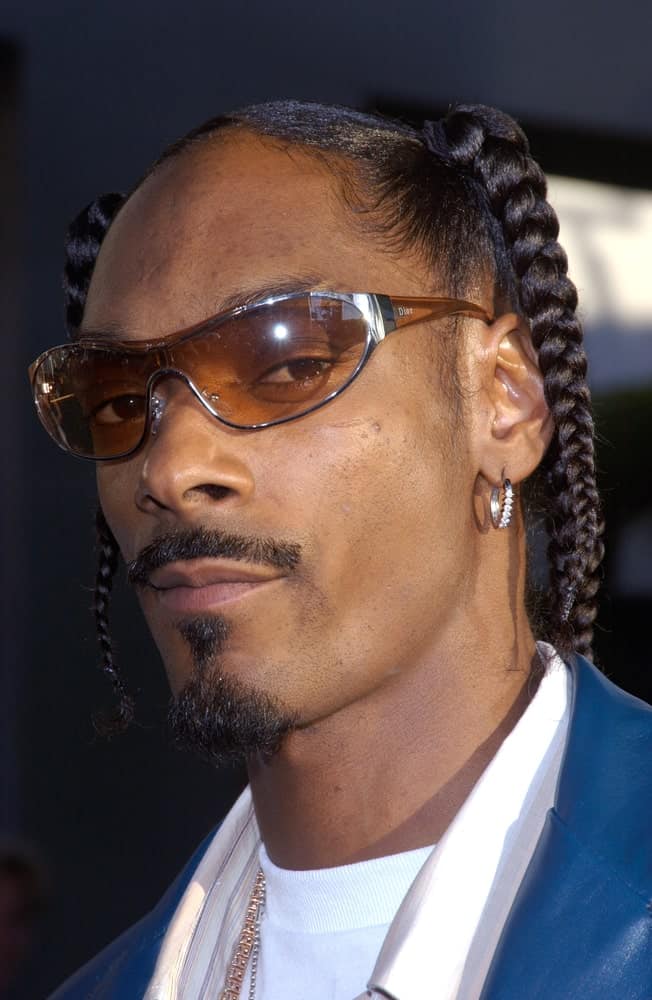 Snoop Dogg have always wear his favorite hairstyle, braids, since his younger days. Here's a look at Snoop during the premier of Catwoman in Hollywood.