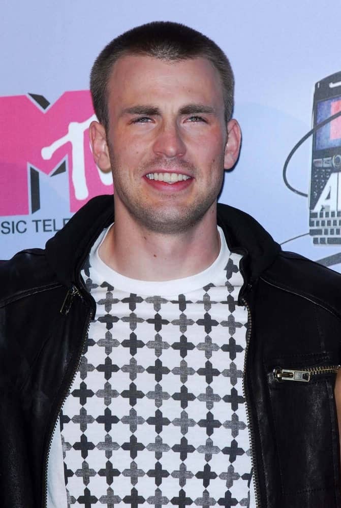 Chris Evans sported an edgy buzz cut hairstyle to go with his casual black leather jacket and brilliant smile at the 2007 MTV Movie Awards held at the Gibson Amphitheatre in Universal City.