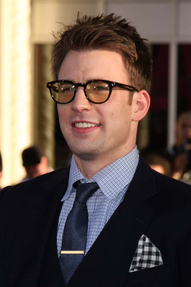 Chris Evans paired his brushed-up and spiked undercut hairstyle with a pair of colored spectacles at the "Captain America: The First Avenger" Premiere at El Capitan Theater on July 19, 2011 in Los Angeles, CA.