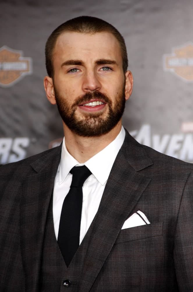 Chris Evans paired his buzz cut hairstyle with a scruffy full beard and a three-piece suit at the Los Angeles premiere of "The Avengers" held at the El Capitan Theater in Hollywood on April 11, 2012.
