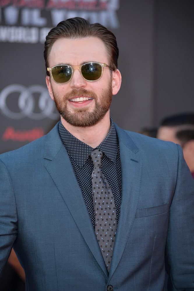 On April 12, 2016, Actor Chris Evans looked absolutely cool with his sunglasses, charcoal suit and slick pompadour hairstyle at the world premiere of "Captain America: Civil War" at the Dolby Theatre, Hollywood.
