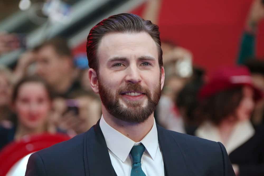 Chris Evans was a picture of dapper sophistication in his classy suit, trimmed beard and side-parted slick hairstyle at the European film premiere of 'Captain America: Civil War' at Vue Westfield on April 26, 2016 in London, England.