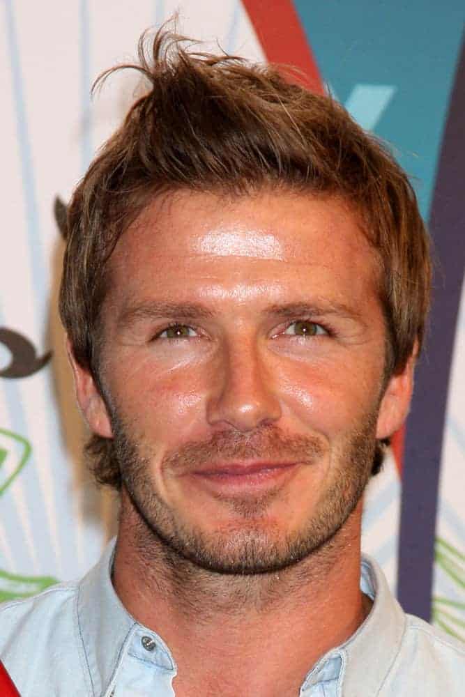 David Beckham styled his elongated hair with an outgrown temple and nape haircut as well as some quiff at the front during the 2010 Teen Choice Awards at Gibson Amphitheater at Universal on August 8, 2010 in Los Angeles, CA.