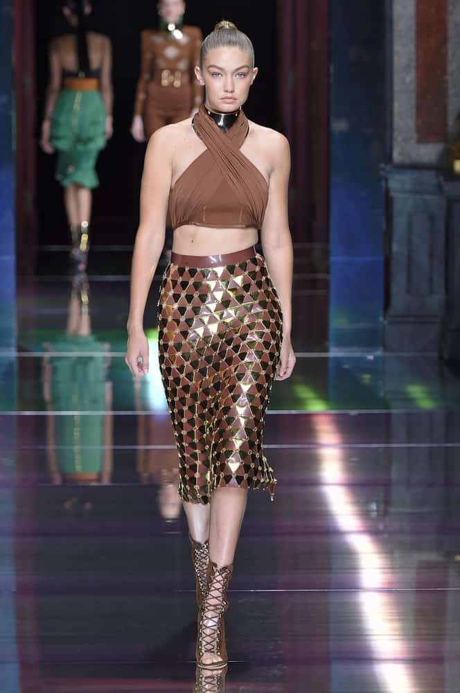 The beautiful bone structure of Gigi Hadid was emphasized with her slick high ponytail when she walked the runway during the Balmain show on October 1, 2015 in Paris, France.