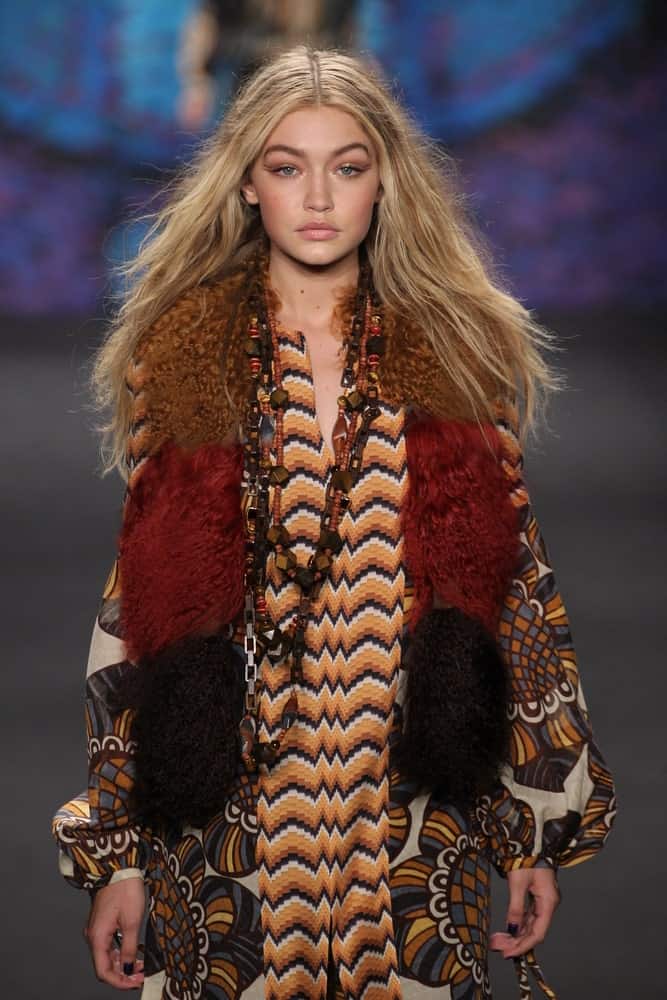 Model Gigi Hadid's mesmerizing eyes were on full display with her long tousled sandy blond hair when she walked the runway at the Anna Sui fashion show during MBFW Fall 2015 at Lincoln Center on February 18, 2015.