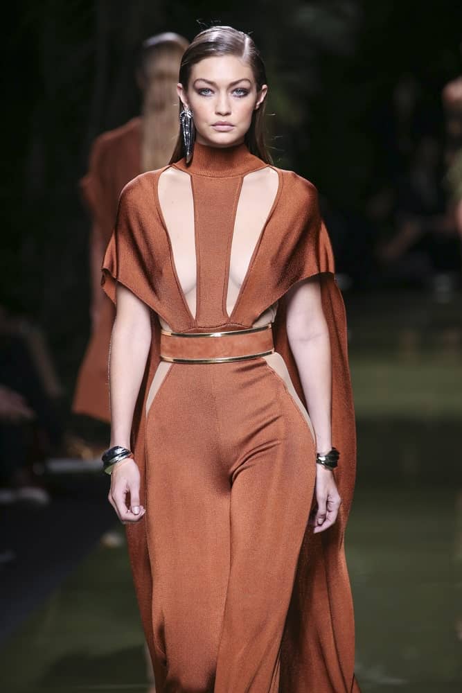 Gigi Hadid's fierce eyebrows were emphasized by her slick side-parted hairstyle when she walked the runway during the Balmain show as part of the Paris Fashion Week Spring/Summer 2017 on September 29, 2016 in Paris, France.