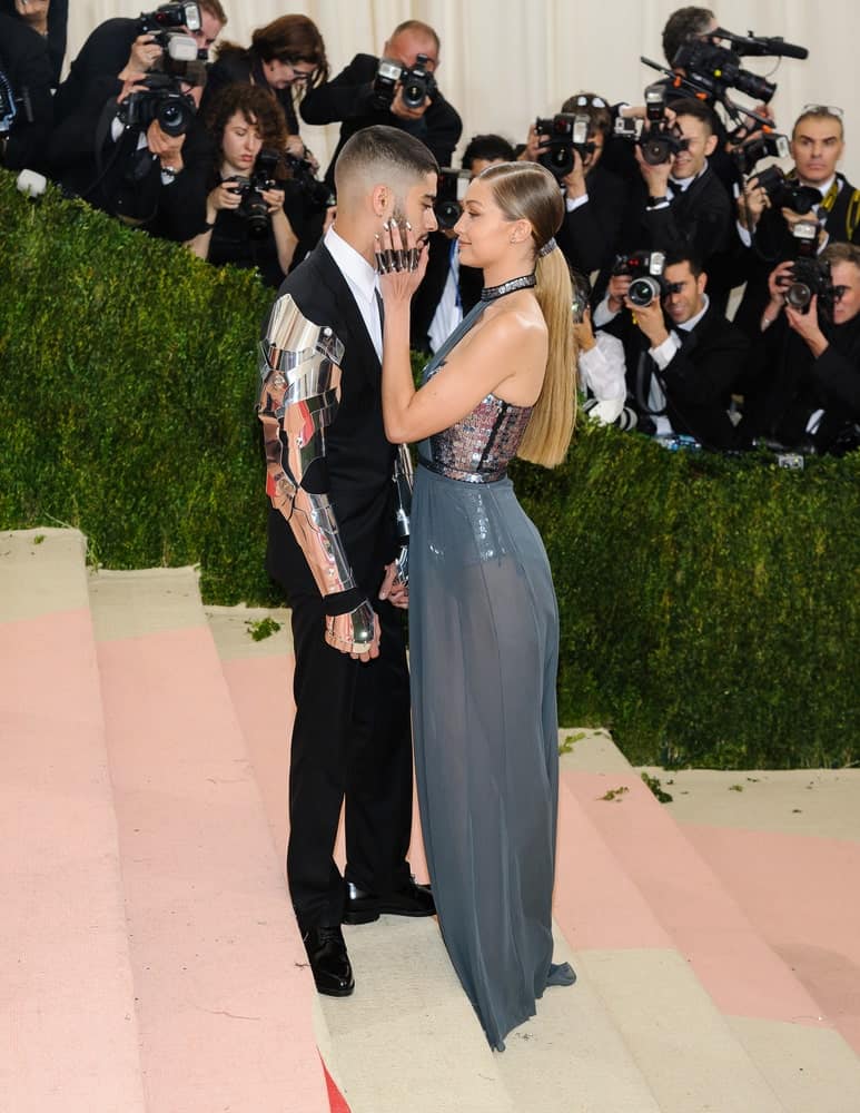 Zayn Malik and Gigi Hadid wore matching outfits at the Metropolitan Museum of Art Costume Institute Gala, Manus x Machina: Fashion in the Age of Technology on May 2, 2016. Hadid paired this with a neat highlighted low ponytail.
