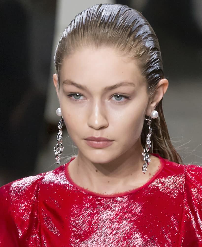 Gigi Hadid was dressed in a glittery red outfit and her hair was slicked back when she walked the runway at the Prabal Gurung Spring Summer 2018 fashion show during New York Fashion Week on September 10, 2017.