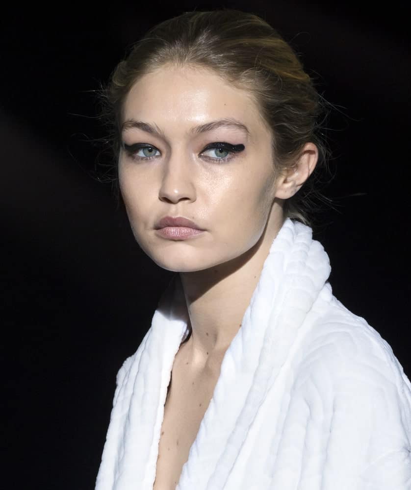 On September 06, 2017, Gigi Hadid walked the runway during rehearsal for the Tom Ford Spring Summer 2018 fashion show in New York. She was still wearing her bathrobe with her hair in a highlighted messy bun hairstyle.