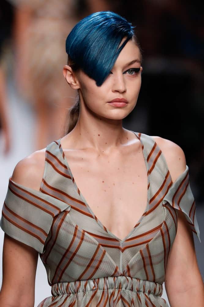 Gigi Hadid's lovely gray dress was paired with a ponytail that has blue-dyed side-swept bangs at the runway for the Fendi show during Milan Fashion Week Spring/Summer 2018 on September 21, 2017 in Milan, Italy.