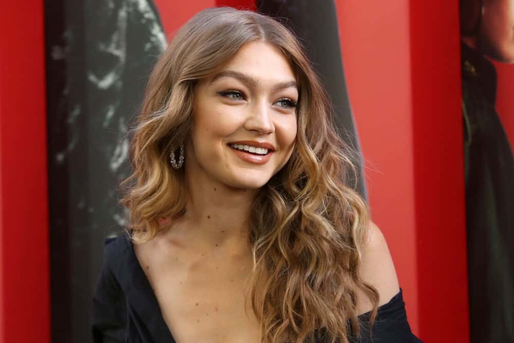 Gigi Hadid looked absolutely gorgeous with her black dress and long wavy lo...