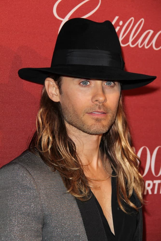 The actor is oozing with charm in a gray suit and cowboy hat paired with his long layered locks. This look was worn at The Hollywood Reporter's Annual Nominees Night Party held on February 10, 2014.