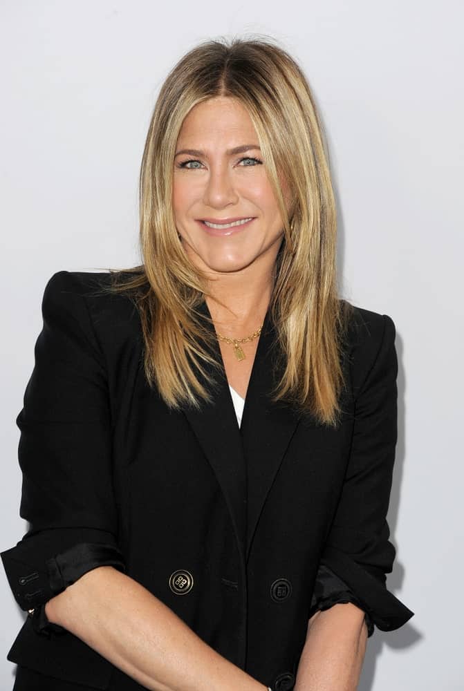 Jennifer Aniston was spotted at the WE Day California held at The Forum in Inglewood, the USA on April 19, 2018. She wore a black blazer that contrasts her blonde hair styled with feathered layers.