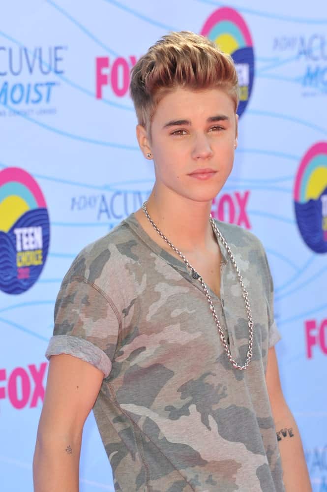 The singer showcased a high pompadour hairstyle in brown matching his stunning eyes. This look was worn at the 2012 Teen Choice Awards last July 23, 2012.