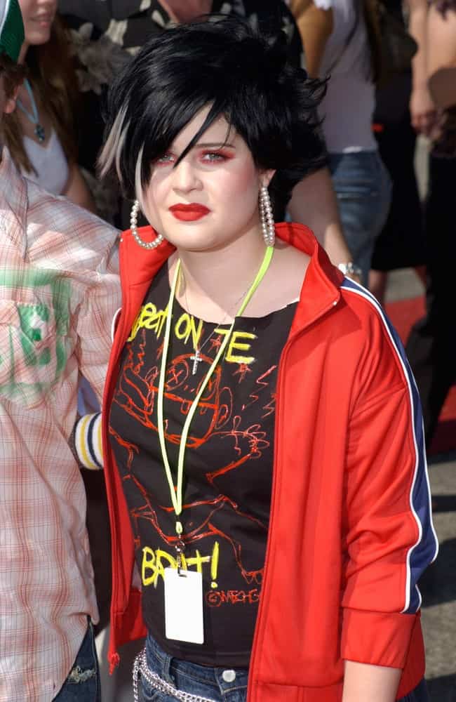 Kelly Osbourne in her teenage days with a rebellious vibe, street-style fashion and a black hairstyle with bangs. Photo taken on May 31, 2002.
