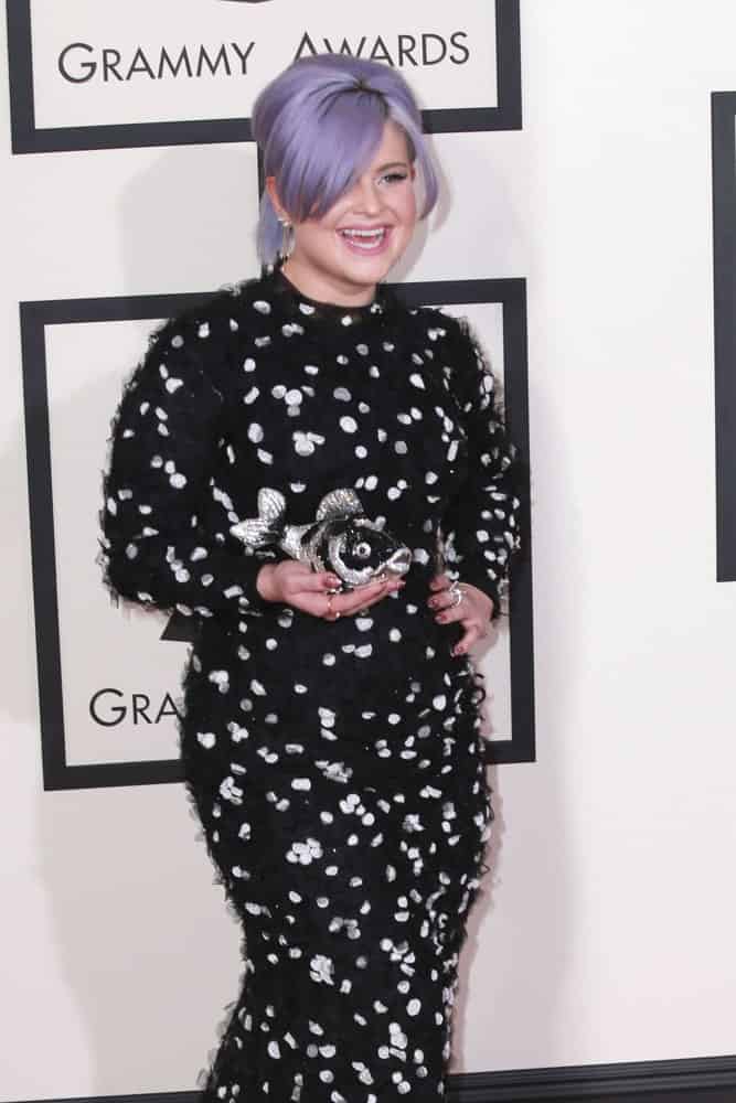 Kelly Osbourne at the 57th Annual GRAMMY Awards Arrivals in Los Angeles, California, February 8, 2015, wearing a gorgeous black and white dress along with her youthful looks.