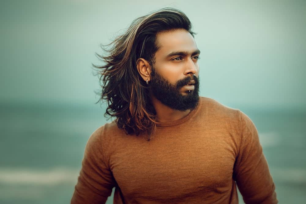 The good thing about a long hair with layers is that you can transform it into a man bun style or leave it as a messy hairstyle. 
