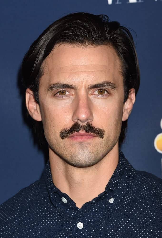 On November 2, 2016, the actor exhibited a serious aura showcasing a combed over hairstyle and a mustache. This photo was taken at the NBC and Vanity Fair 2016-2017 Season Celebration in Los Angeles, CA.