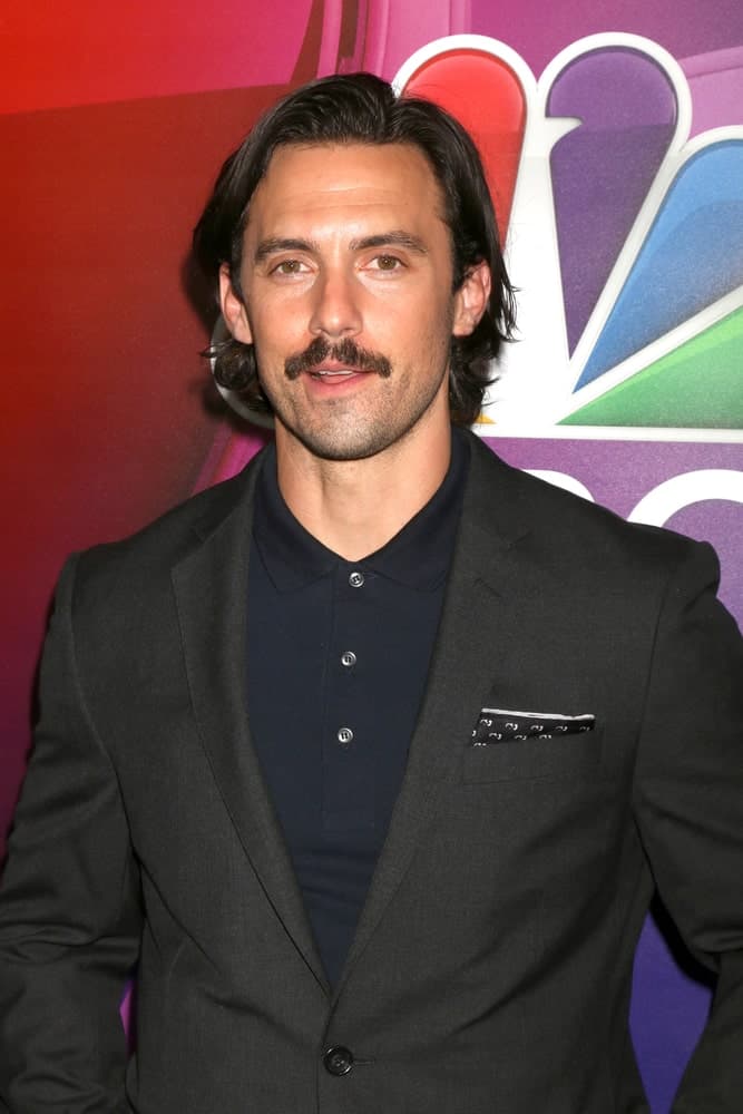 During the NBCUniversal TCA Summer 2016 Press Tour on August 2, 2016, Milo Ventimiglia had long side-swept hair paired with a mustache.