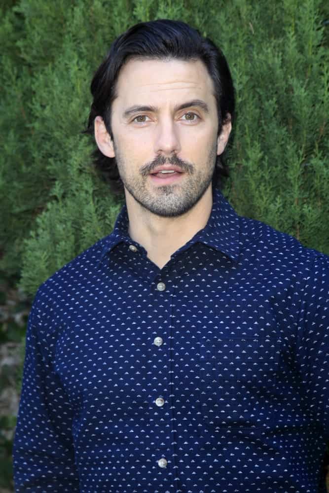The actor wore a dotted long sleeve polo complemented with a combed over hairstyle and a beard at The Rape Foundation's Annual Brunch at the Private Residence on October 8, 2017.