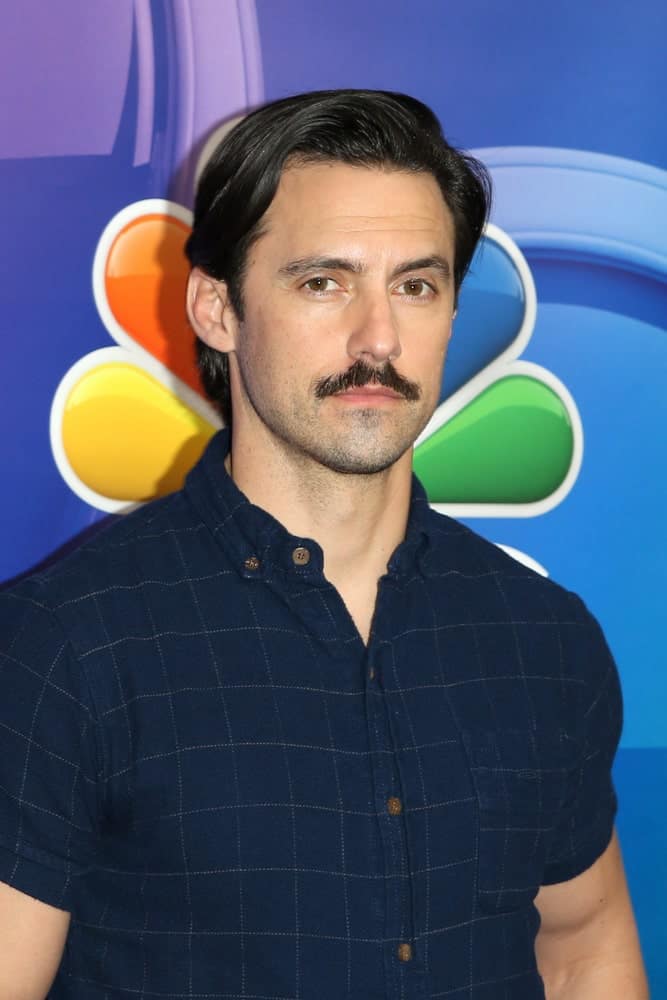 The iconic dad look featuring a side-parted hair plus a mustache sported by the actor Milo Ventimiglia at the NBC's Los Angeles Mid-Season Press Junket held on February 20, 2019.