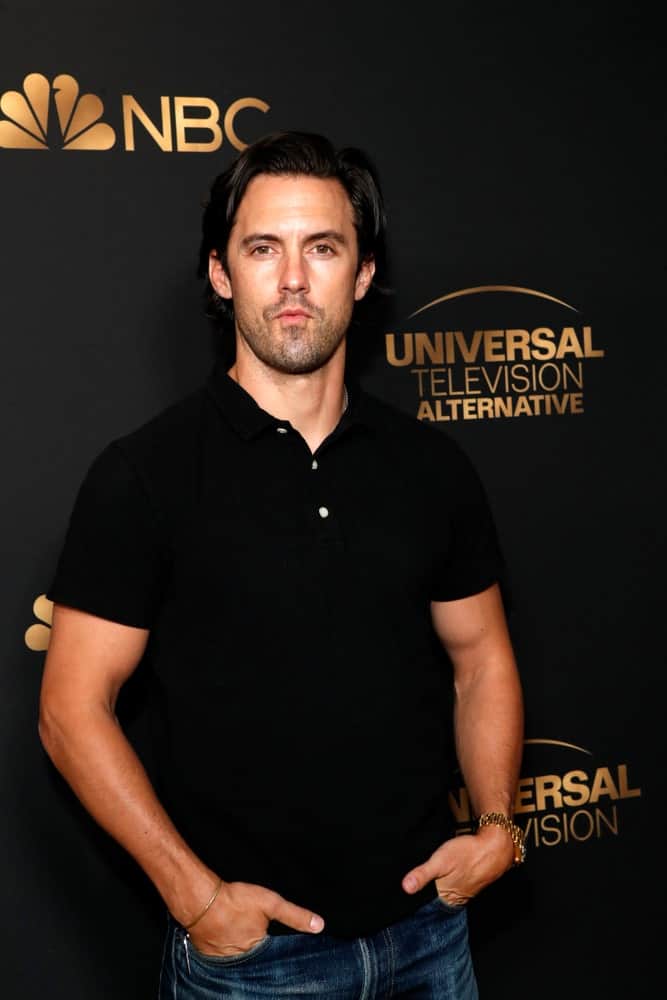 The actor's black side-parted hair is a perfect match with his plain polo shirt at the NBC And Universal EMMY Nominee Celebration at the Tesse Restaurant on August 13, 2019.