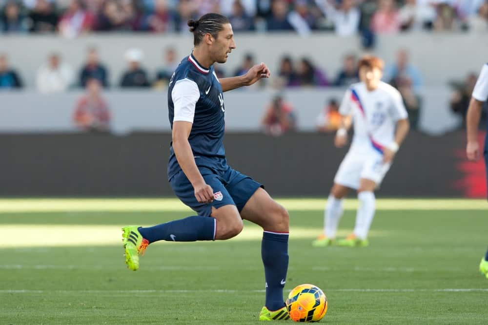 US Soccer Team defender, Omar Gonzales playing against Korea Republic on February 1, 2014, a friendly match in Carson, California. He is sporting a man bun hairstyle.