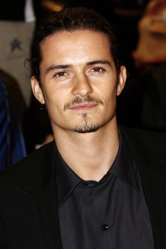 Orlando Bloom was at the "Elizabethtown" Premiere at the Toronto Film Festival held in Roy Thomson Hall, on September 10, 2005. He was quite rugged with his trimmed beard and man-bun hairstyle.