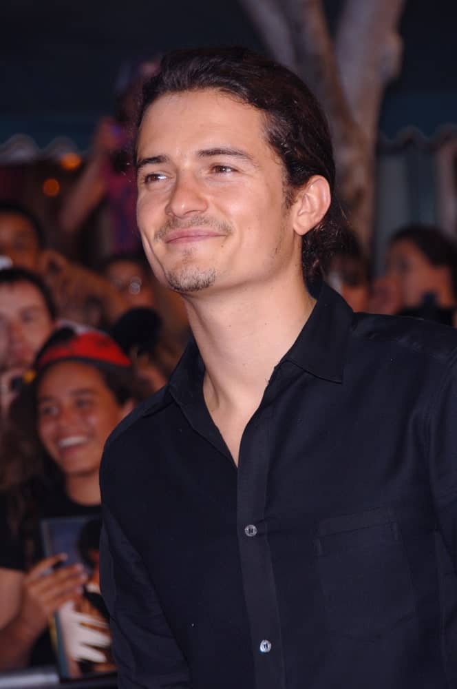 Actor ORLANDO BLOOM was seen with a gorgeous low ponytail at the world premiere of his new movie "Pirates of the Caribbean: Dead Man's Chest" at Disneyland, CA on June 24, 2006.