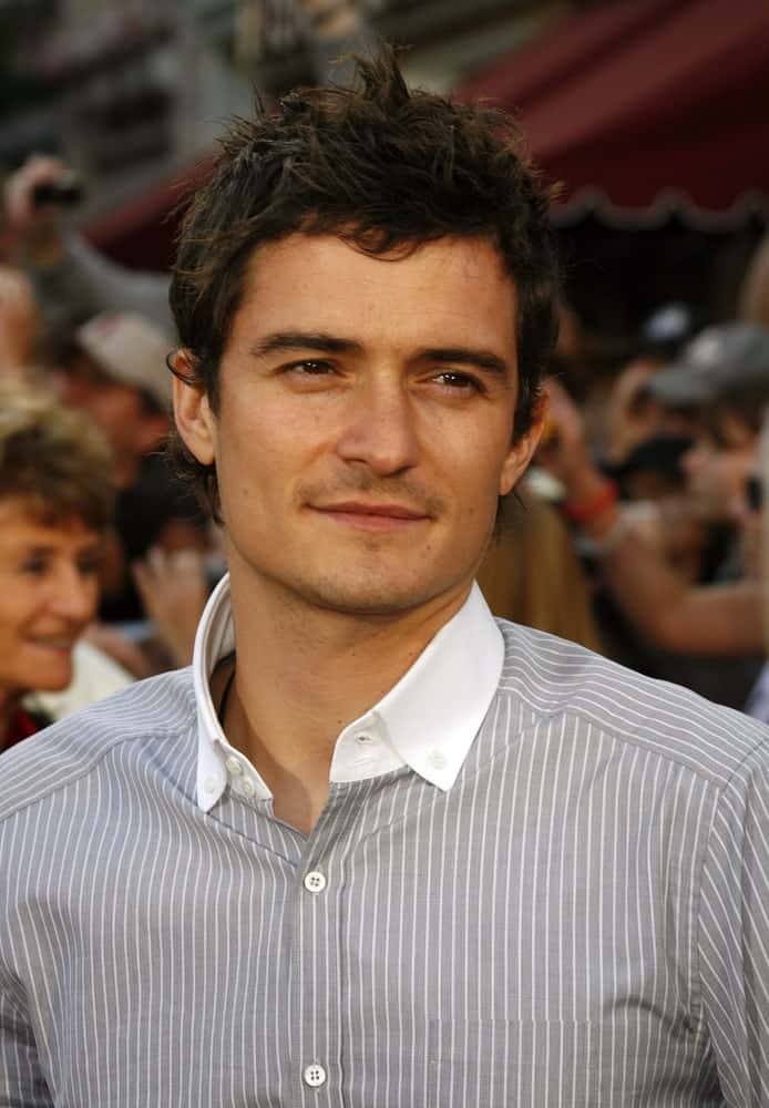 Orlando Bloom attended the World Premiere of "Pirates of the Caribbean: At World's End" held at Disneyland in Anaheim, California on May 19, 2007. He wore a patterned button-down shirt that wet well with his short spiky hairstyle.