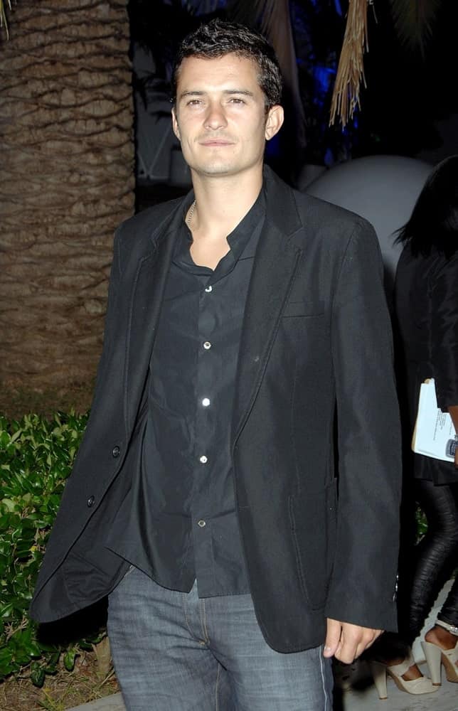 Orlando Bloom wore a smart casual ensemble outfit and jeans with his short and curly crew cut fade hairstyle at The Tar Estate in Bel Air, CA on August 23, 2008.