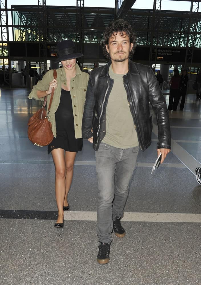 Actor Orlando Bloom and his wife were seen at LAX on September 9, 2010 in Los Angeles, California. Bloom was wearing a casual outfit to go with his long, curly and messy fringe hairstyle.