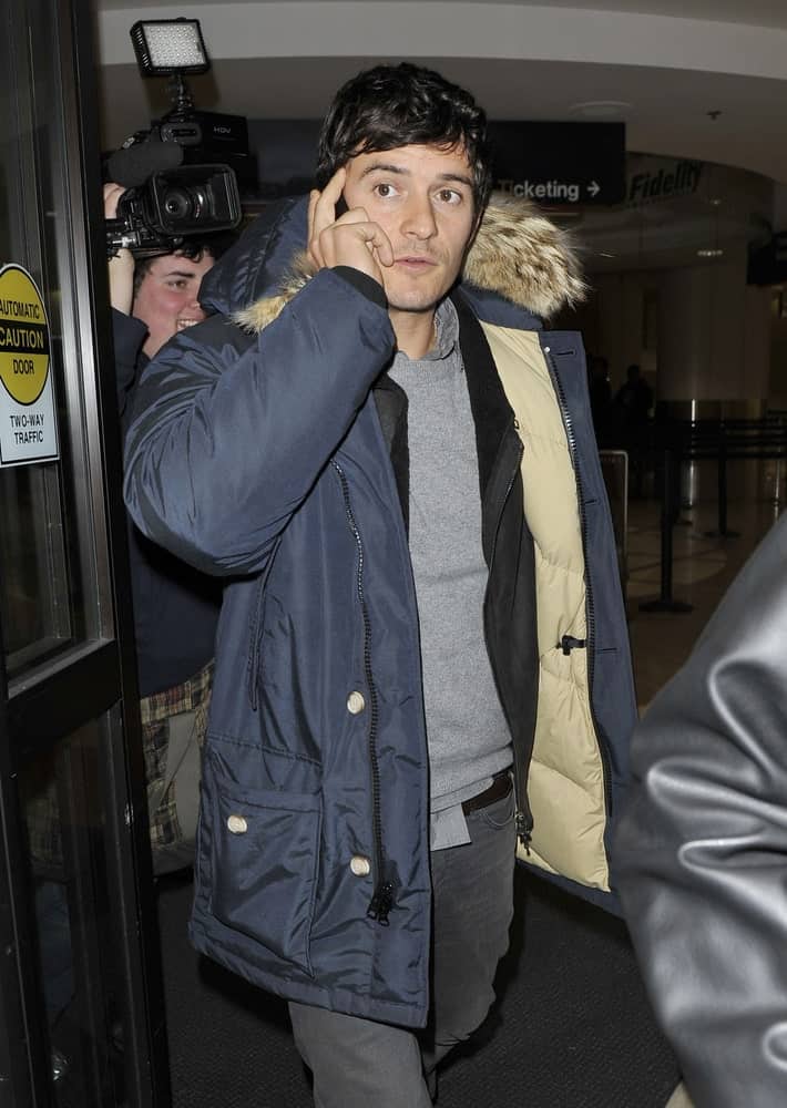 Actor Orlando Bloom reigned in his curls into a soft side-parted hairstyle when he was seen at LAX on January 25, 2010 in Los Angeles, California.