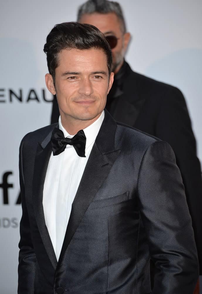 Actor Orlando Bloom's textured dark tux is complemented by his slick pompadour that is slightly swept to the side at the amfAR Cinema Against AIDS Gala 2016 at the Hotel du Cap d'Antibes.