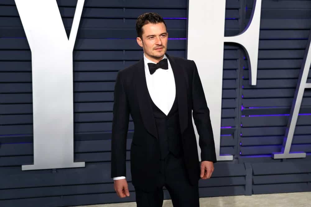Orlando Bloom went for a classy look with his black tux and slicked back dark hair at the 2019 Vanity Fair Oscar Party at The Wallis Annenberg Center for the Performing Arts on February 24, 2019 in Beverly Hills, CA.